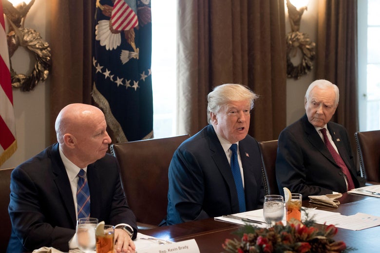 US President Donald Trump speaks about tax reform legislation during a lunch with lawmakers working on the tax reform conference committee, including Senator Orrin Hatch (R), Republican of Utah, and Representative Kevin Brady (L), Republican of Texas, in the Cabinet Room at the White House in Washington, DC, December 13, 2017. / AFP PHOTO / SAUL LOEB (Photo credit should read SAUL LOEB/AFP/Getty Images)